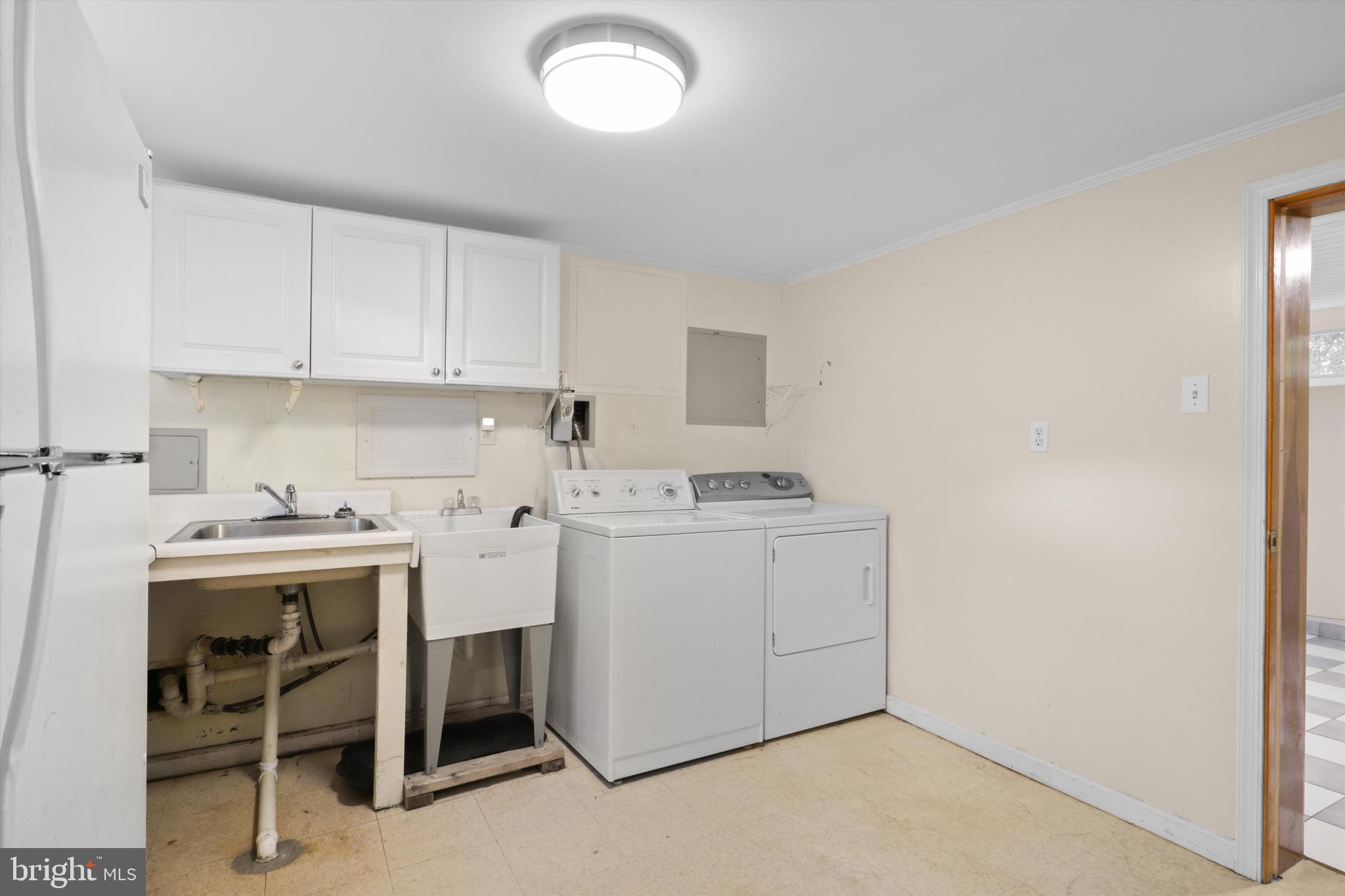 10205 Rodgers Road Fairfax, VA 22030 - Photo 24 of 41 a view of a storage & utility room with a sink