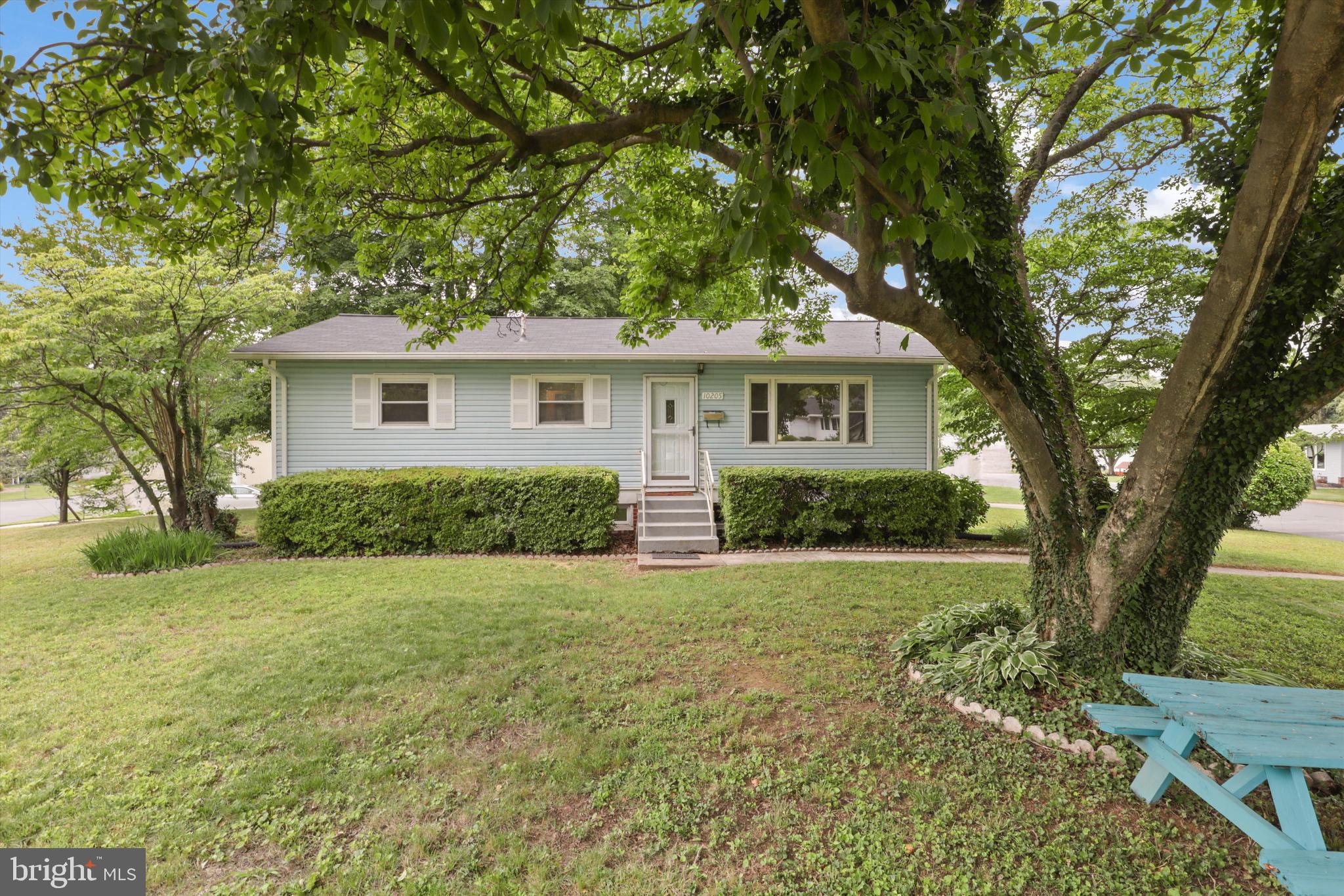 10205 Rodgers Road Fairfax, VA 22030 - Photo 3 of 41 a front view of a house with a yard