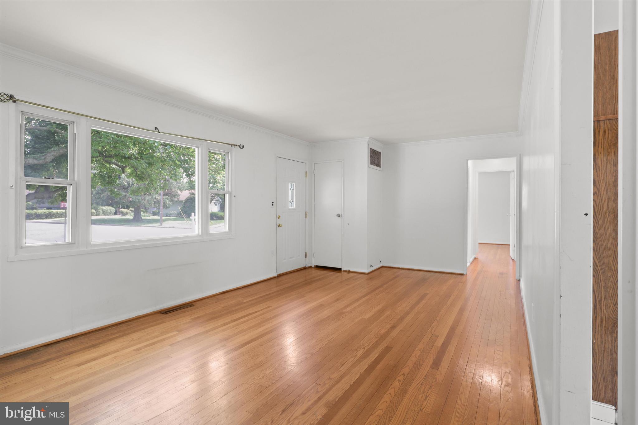 10205 Rodgers Road Fairfax, VA 22030 - Photo 6 of 41 a view of empty room with wooden floor and fan
