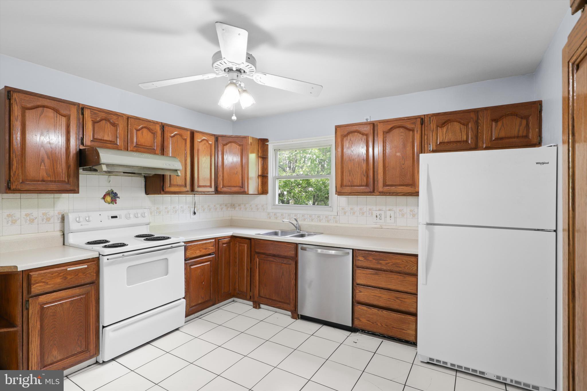 10205 Rodgers Road Fairfax, VA 22030 - Photo 8 of 41 a kitchen with a sink appliances and cabinets