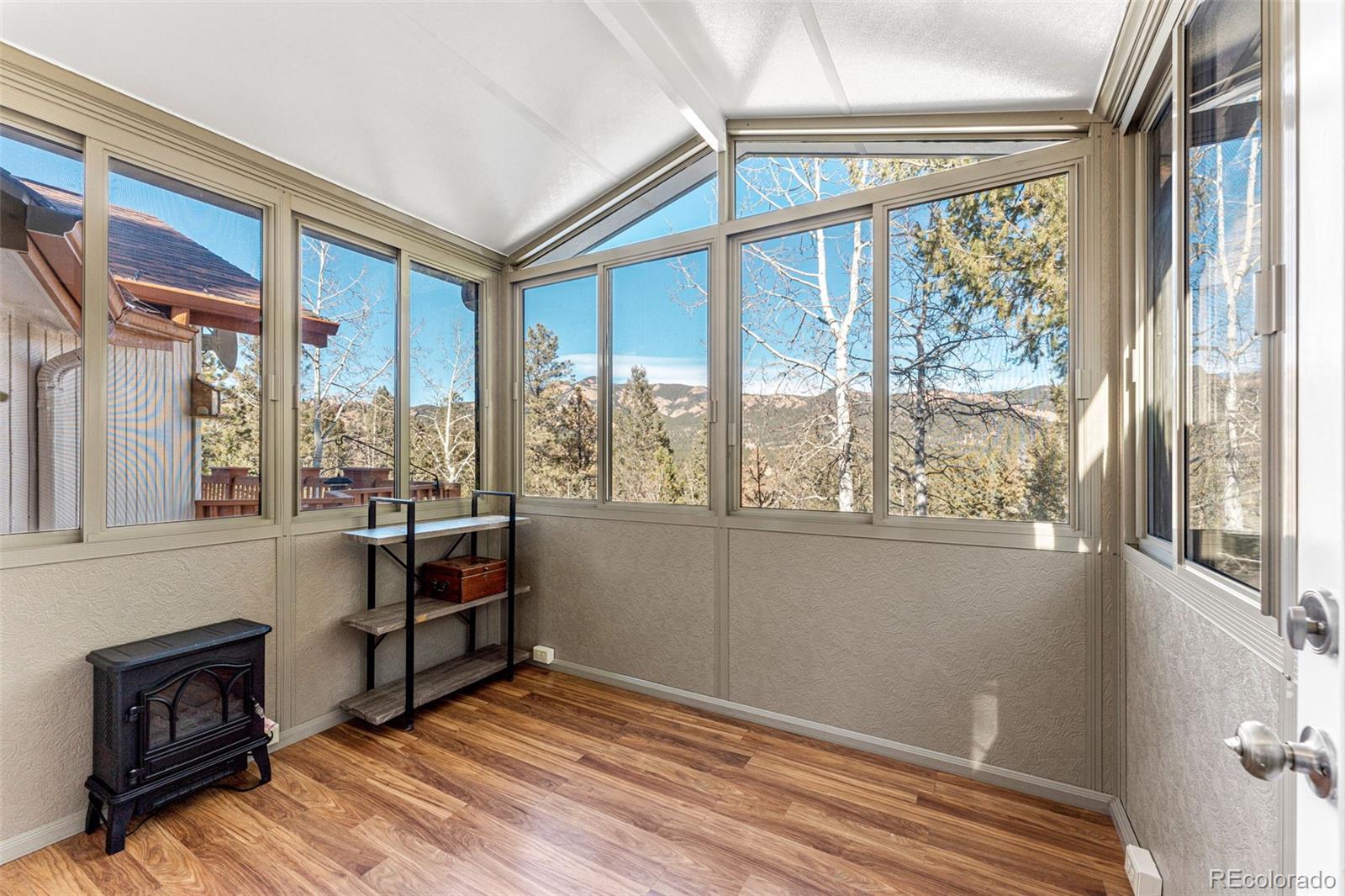 33782 Nova Road Pine, CO 80470 - Photo 11 of 50 a view of livingroom with furniture and windows