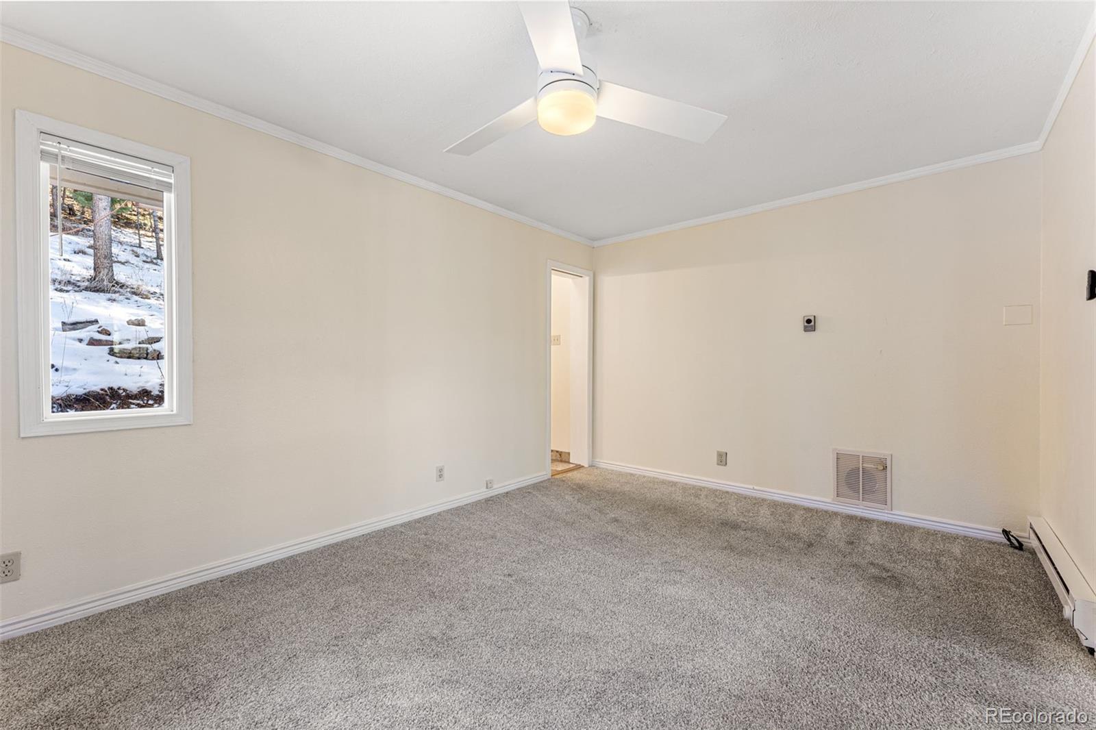 33782 Nova Road Pine, CO 80470 - Photo 15 of 50 a view of an empty room with a window