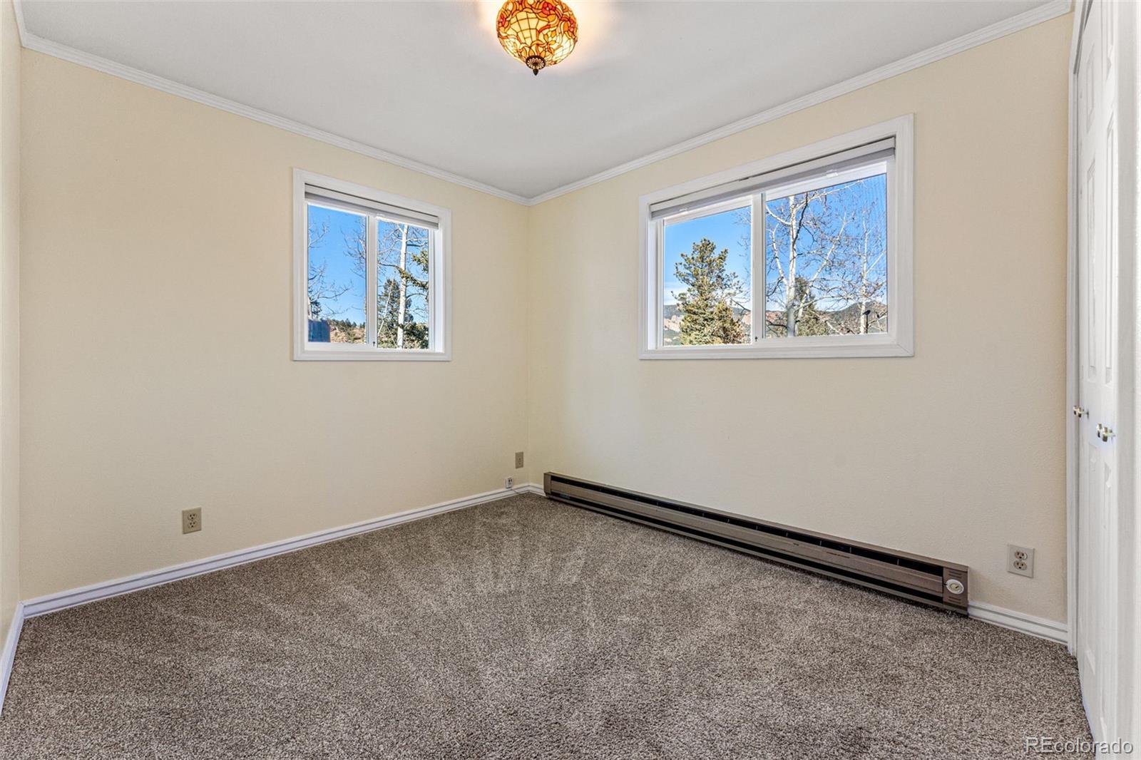 33782 Nova Road Pine, CO 80470 - Photo 18 of 50 a view of an empty room with a window