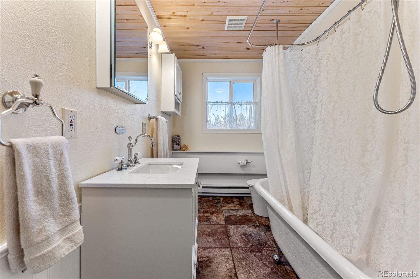 33782 Nova Road Pine, CO 80470 - Photo 20 of 50 a bathroom with a sink and a mirror