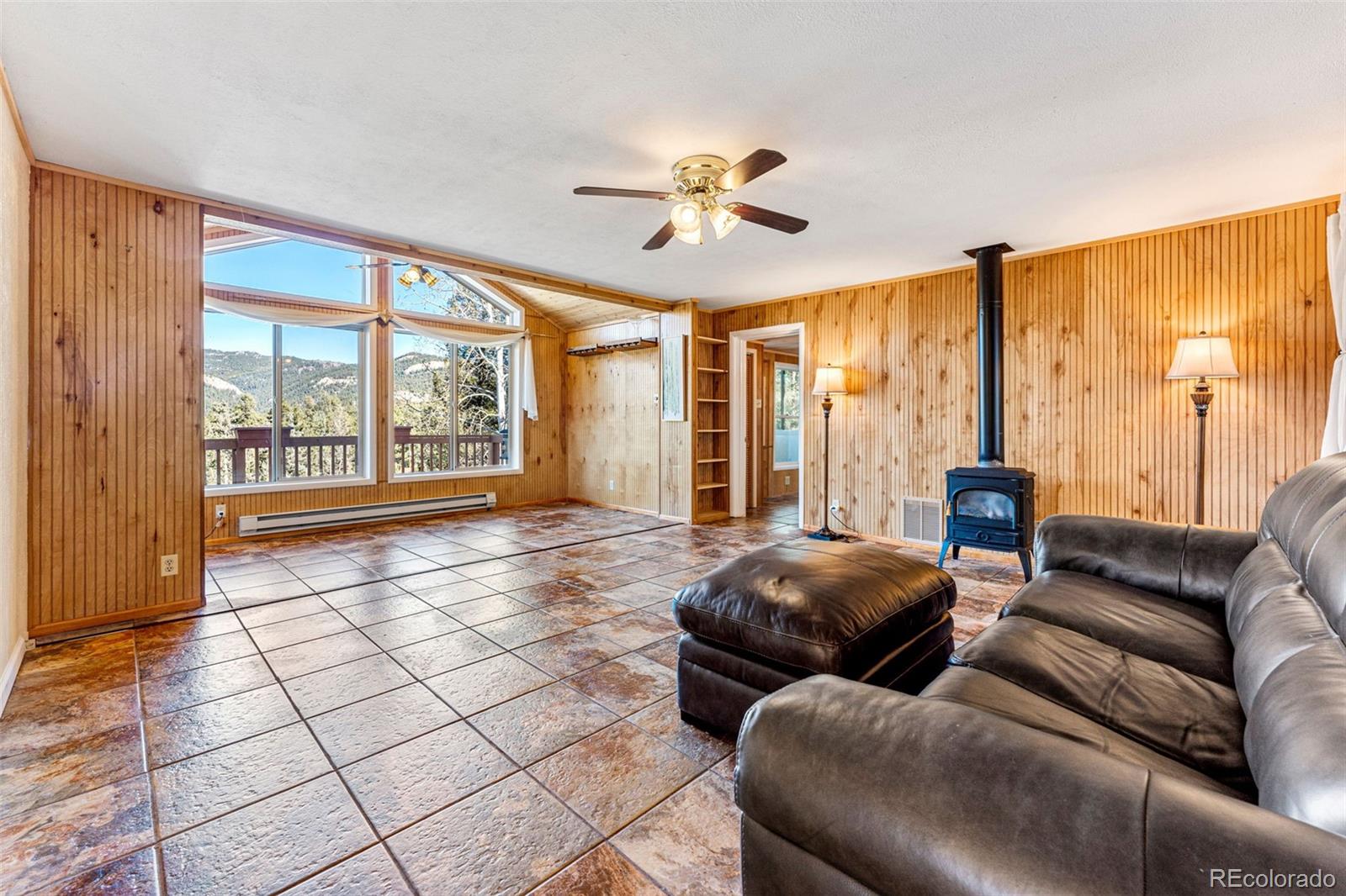 33782 Nova Road Pine, CO 80470 - Photo 2 of 50 a living room with furniture and large windows