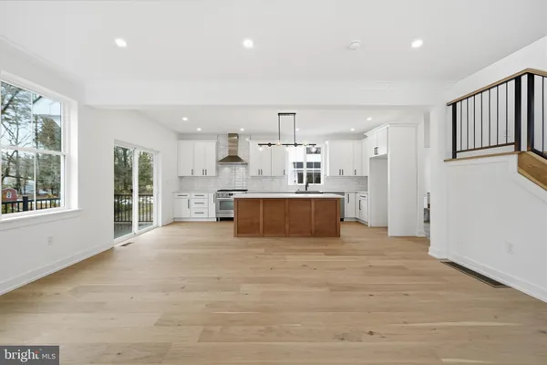 a kitchen with a stove oven and cabinets