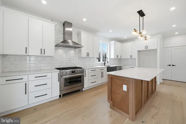 a view of a kitchen with a sink and a large window