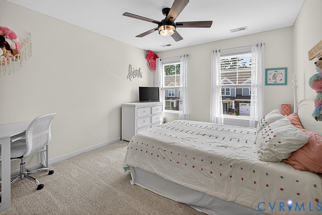 18517 Palisades Ridge Moseley, VA 23120 - Photo 27 of 55 a bed room with a bed and a chair