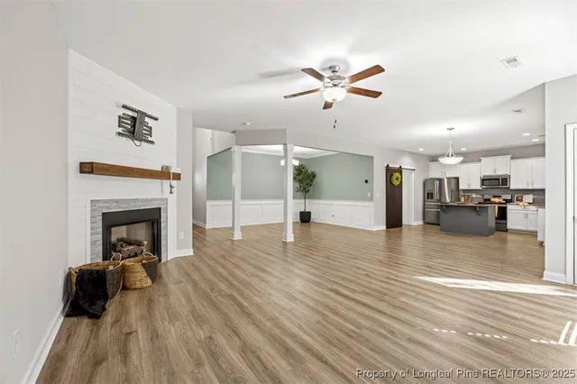 a view of a living room a fireplace with wooden floor