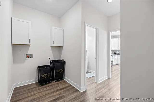 a view of a workspace with wooden floor