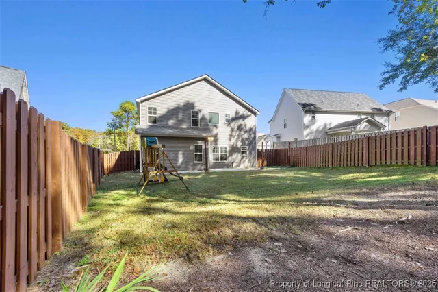 a view of backyard with slide