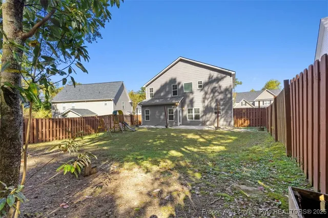 a view of a back yard of the house