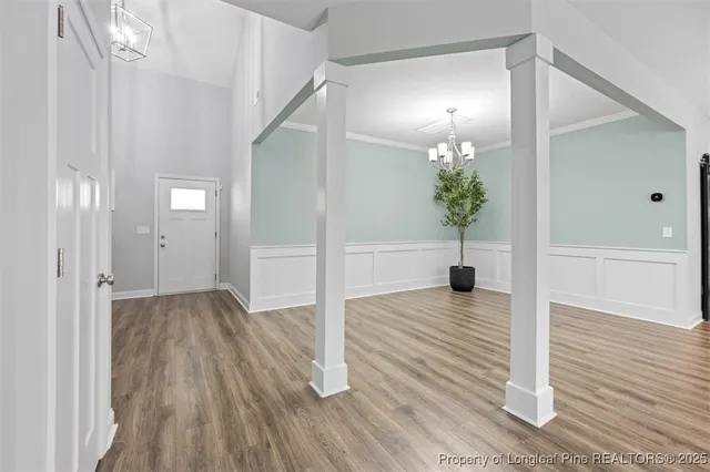 a view of a hallway view with wooden floor and staircase