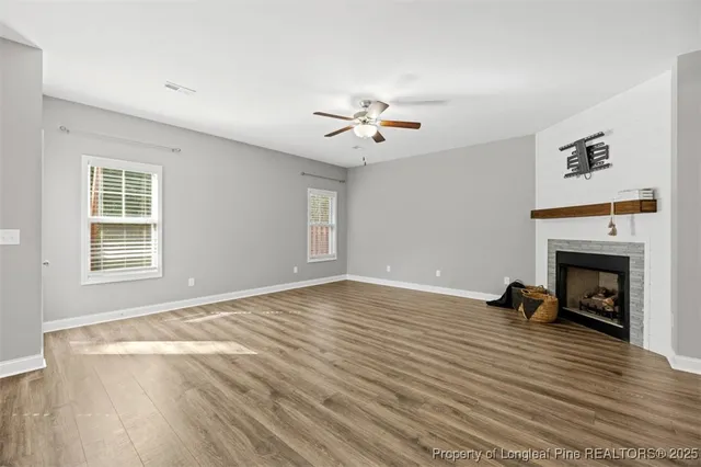 a view of livingroom with furniture fire place and windows