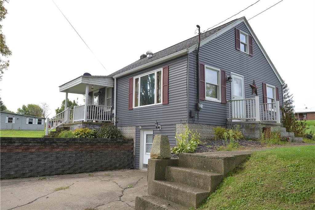 775 Claypoole Road Worthington, PA 16262 - Photo 3 of 18 a front view of a house with a garden