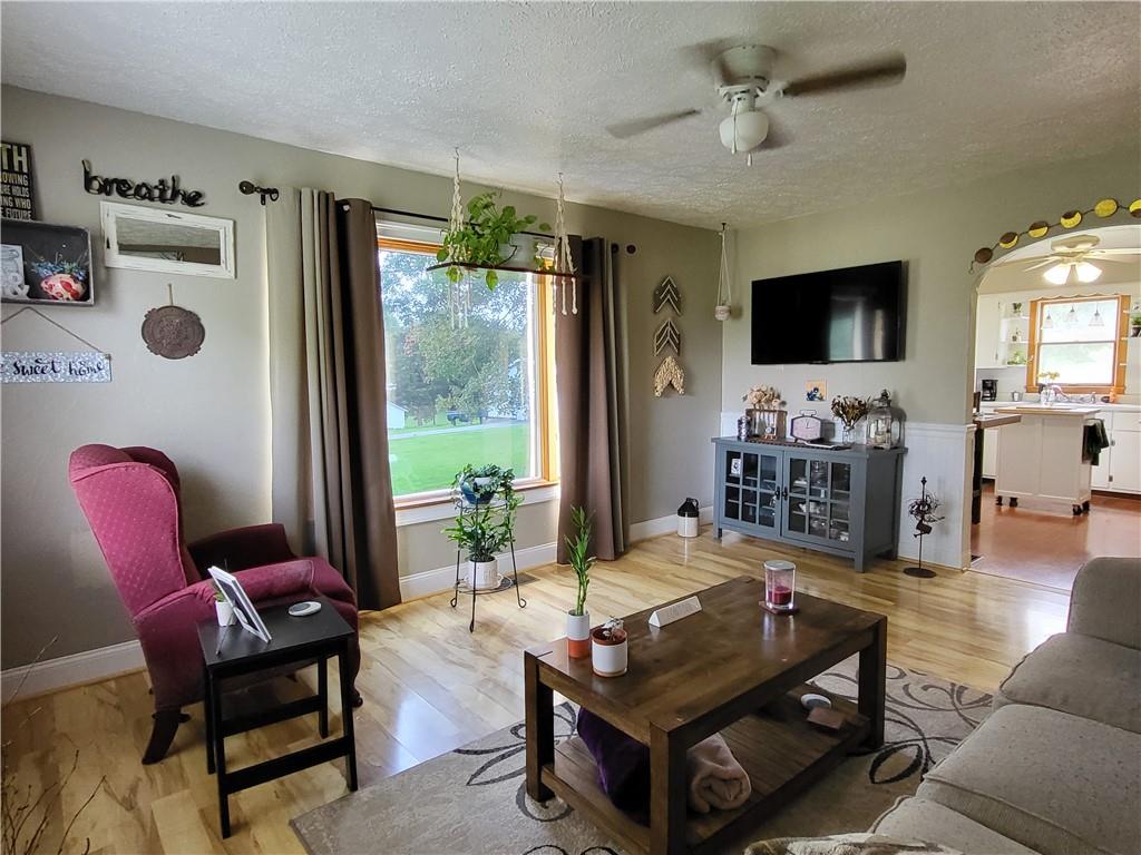 775 Claypoole Road Worthington, PA 16262 - Photo 8 of 18 a living room with furniture a flat screen tv and a large window