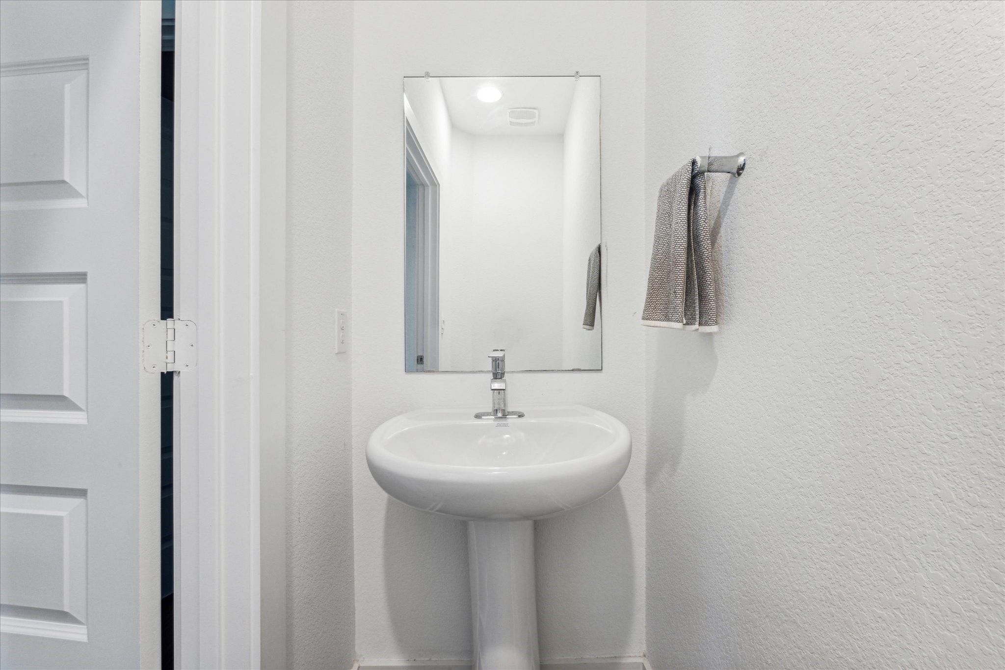 7916 Linnie Lane Austin, TX 78724 - Photo 5 of 13 a bathroom with a sink a mirror and vanity