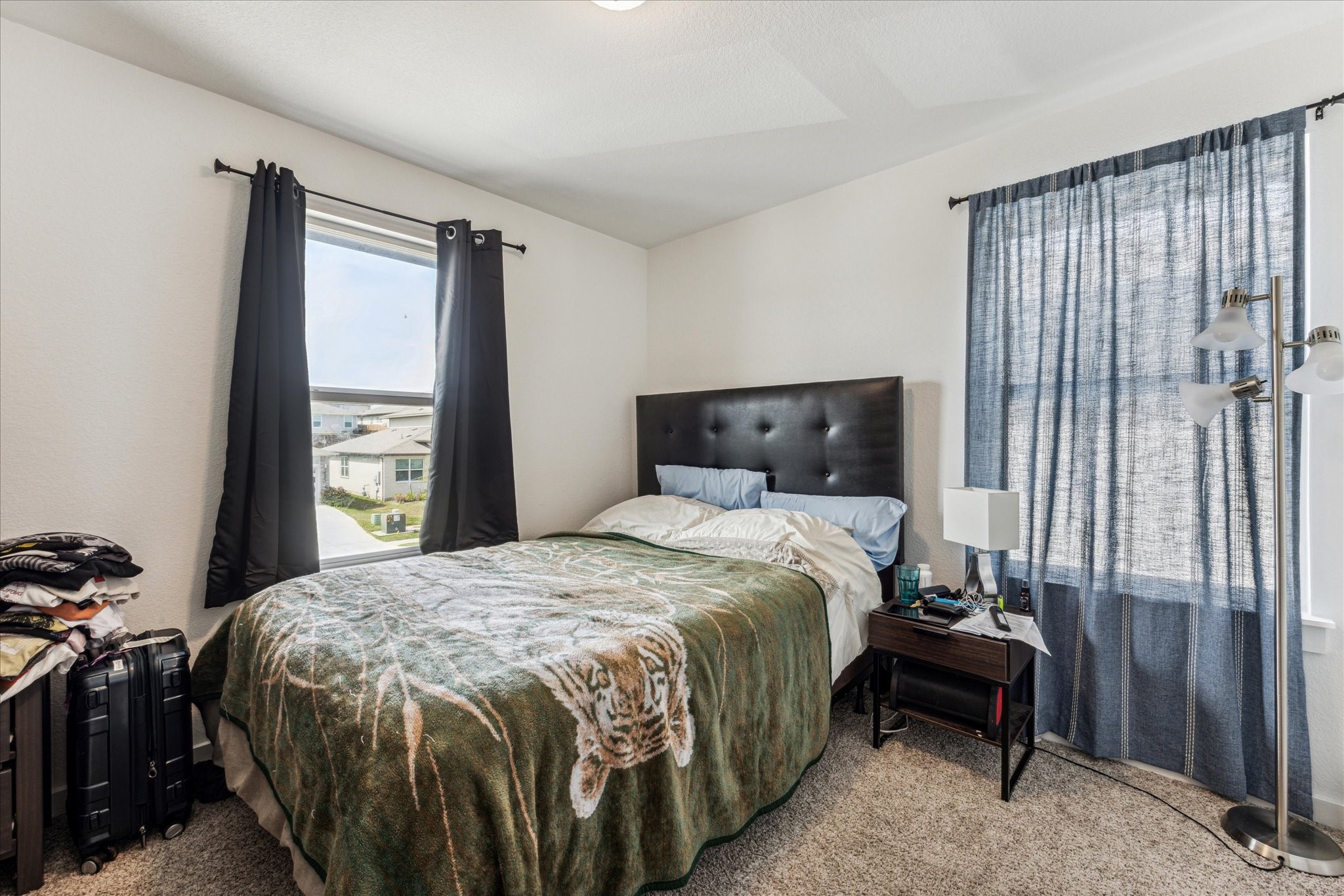 7916 Linnie Lane Austin, TX 78724 - Photo 10 of 13 a bedroom with a bed and a window