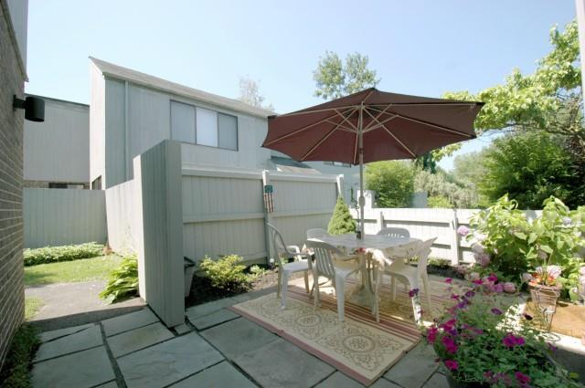 a view of a backyard with sitting area