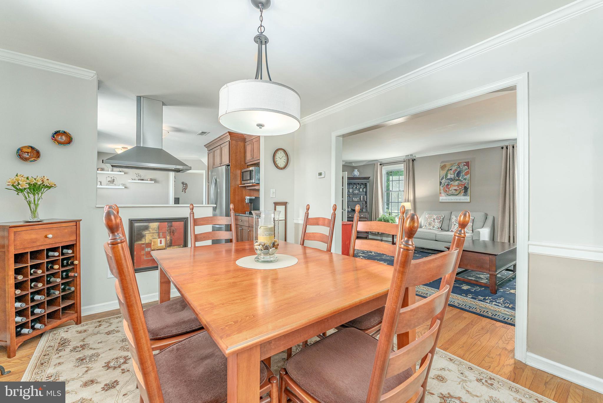 84 North Spring Lane Phoenixville, PA 19460 - Photo 11 of 51 a view of a dining room with furniture a chandelier and wooden floor