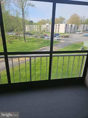 a view of a back yard from a balcony