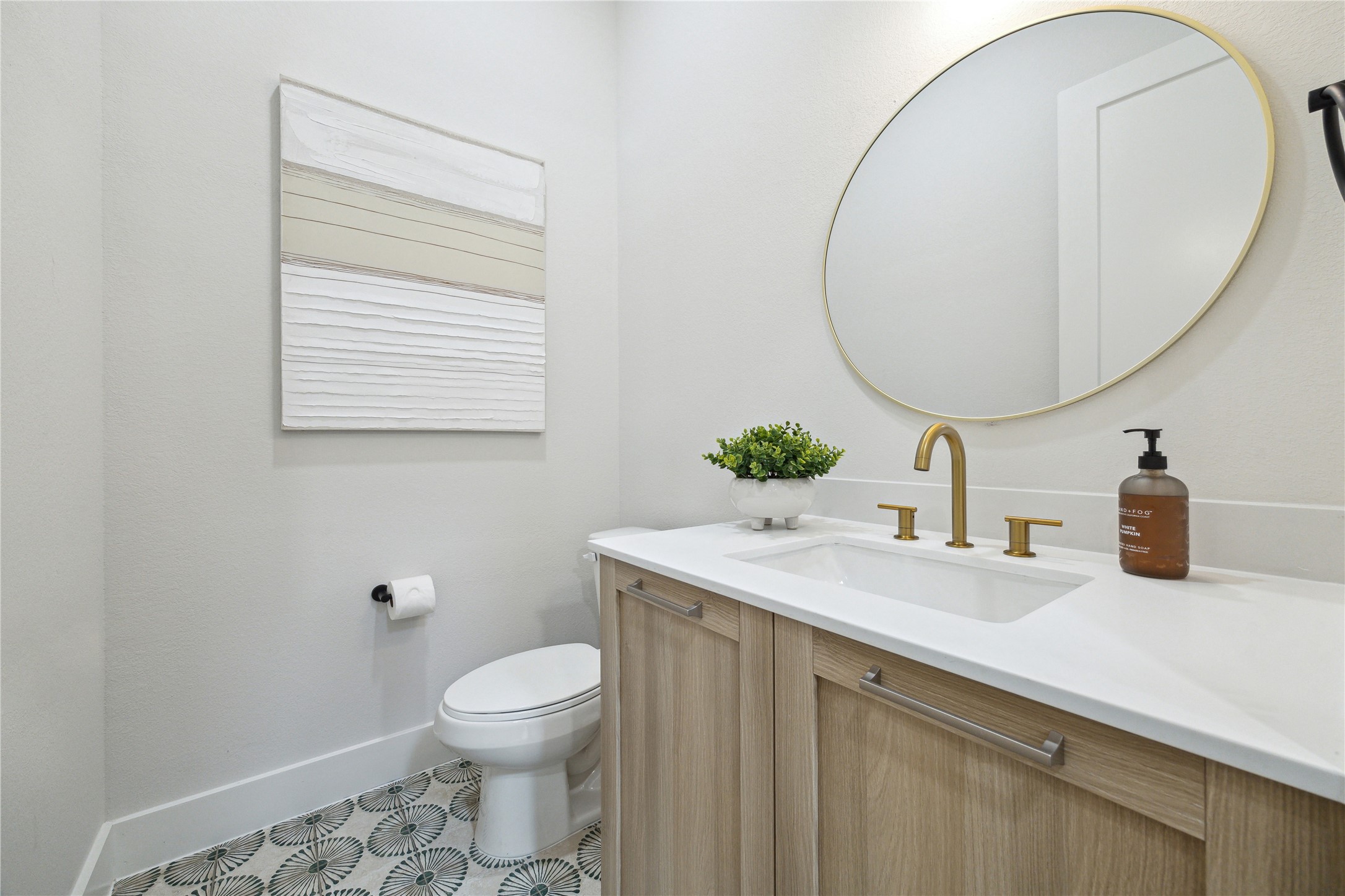 3911 Tulane Street, Unit B Houston, TX 77018 - Photo 13 of 37 Chic powder room featuring modern fixtures, elegant vanity, and stylish tile flooring. Perfect blend of functionality and design.
