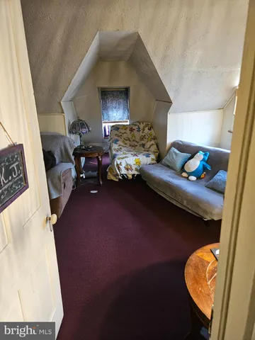 a bed sitting in a room next to a window