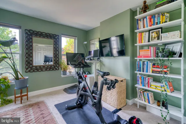 a view of a livingroom with furniture and a flat screen tv