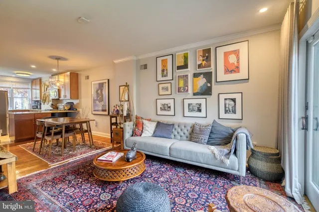 a living room with furniture and a rug
