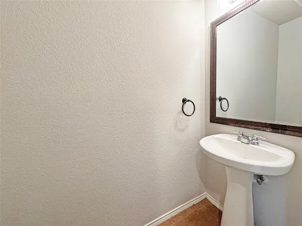 a bathroom with a sink and mirror