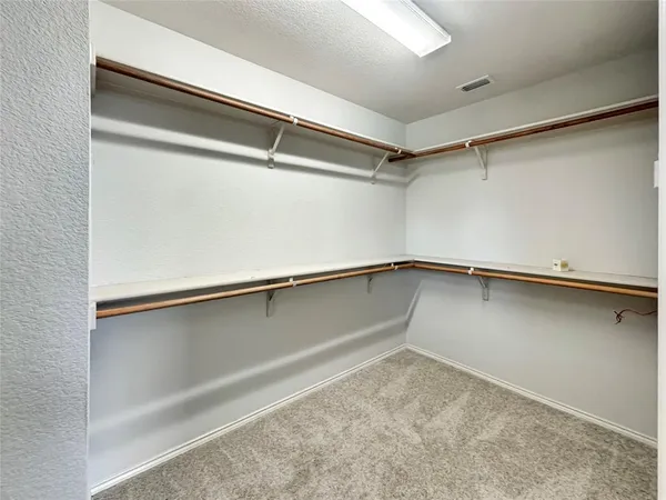 a view of an empty walk in closet