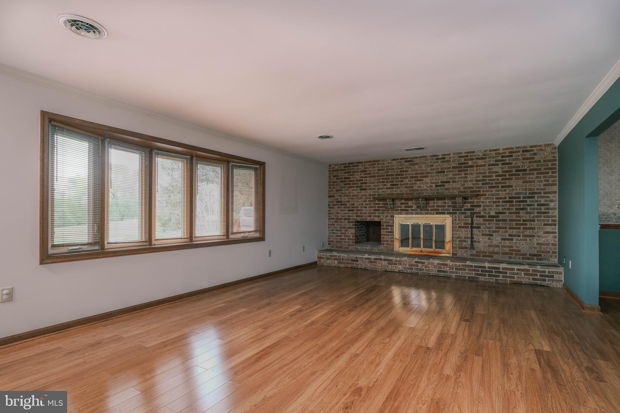 225 Bowling Green Road Front Royal, VA 22630 - Photo 20 of 77 a view of an empty room with wooden floor and a window