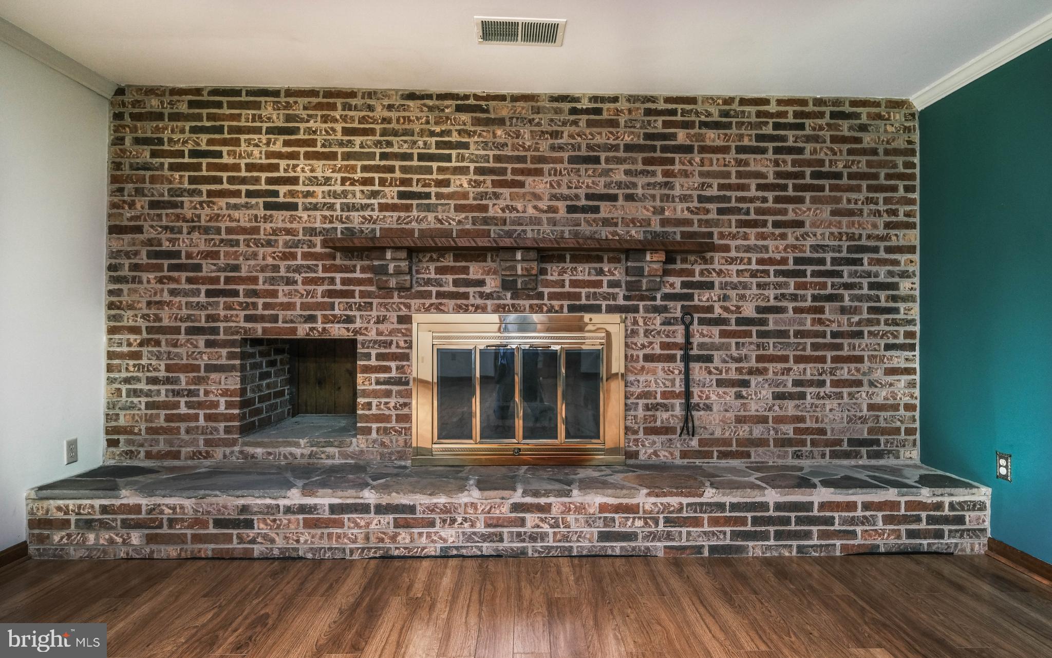 225 Bowling Green Road Front Royal, VA 22630 - Photo 22 of 77 a view of a fireplace with wooden floor