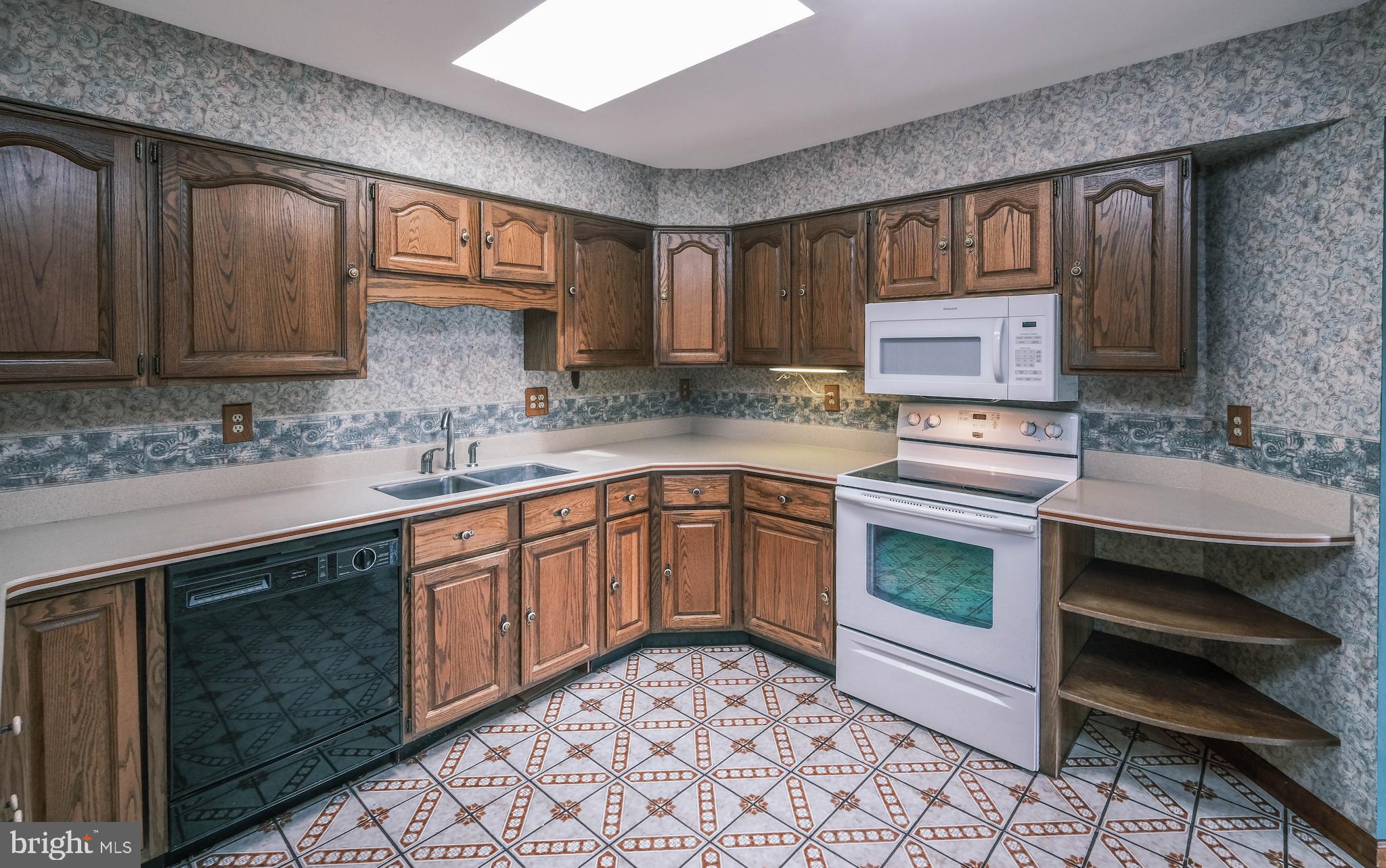 225 Bowling Green Road Front Royal, VA 22630 - Photo 26 of 77 a kitchen with a sink stove and microwave