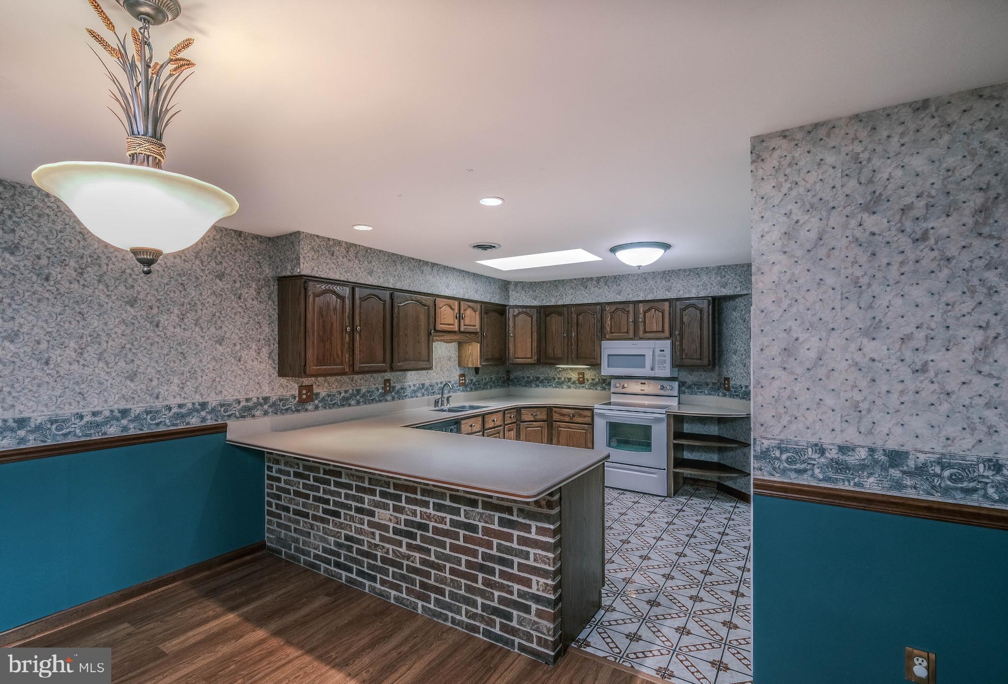 225 Bowling Green Road Front Royal, VA 22630 - Photo 27 of 77 a kitchen with stainless steel appliances granite countertop a sink and a stove