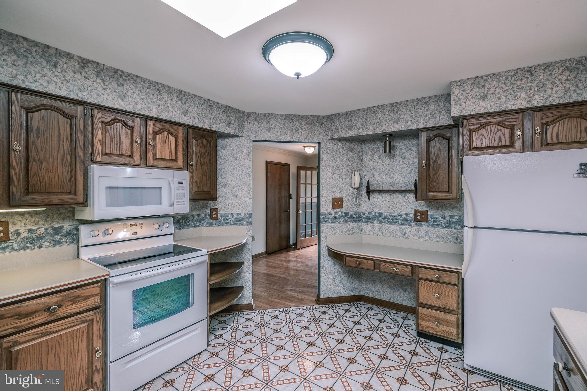 225 Bowling Green Road Front Royal, VA 22630 - Photo 28 of 77 a kitchen with a stove and a refrigerator