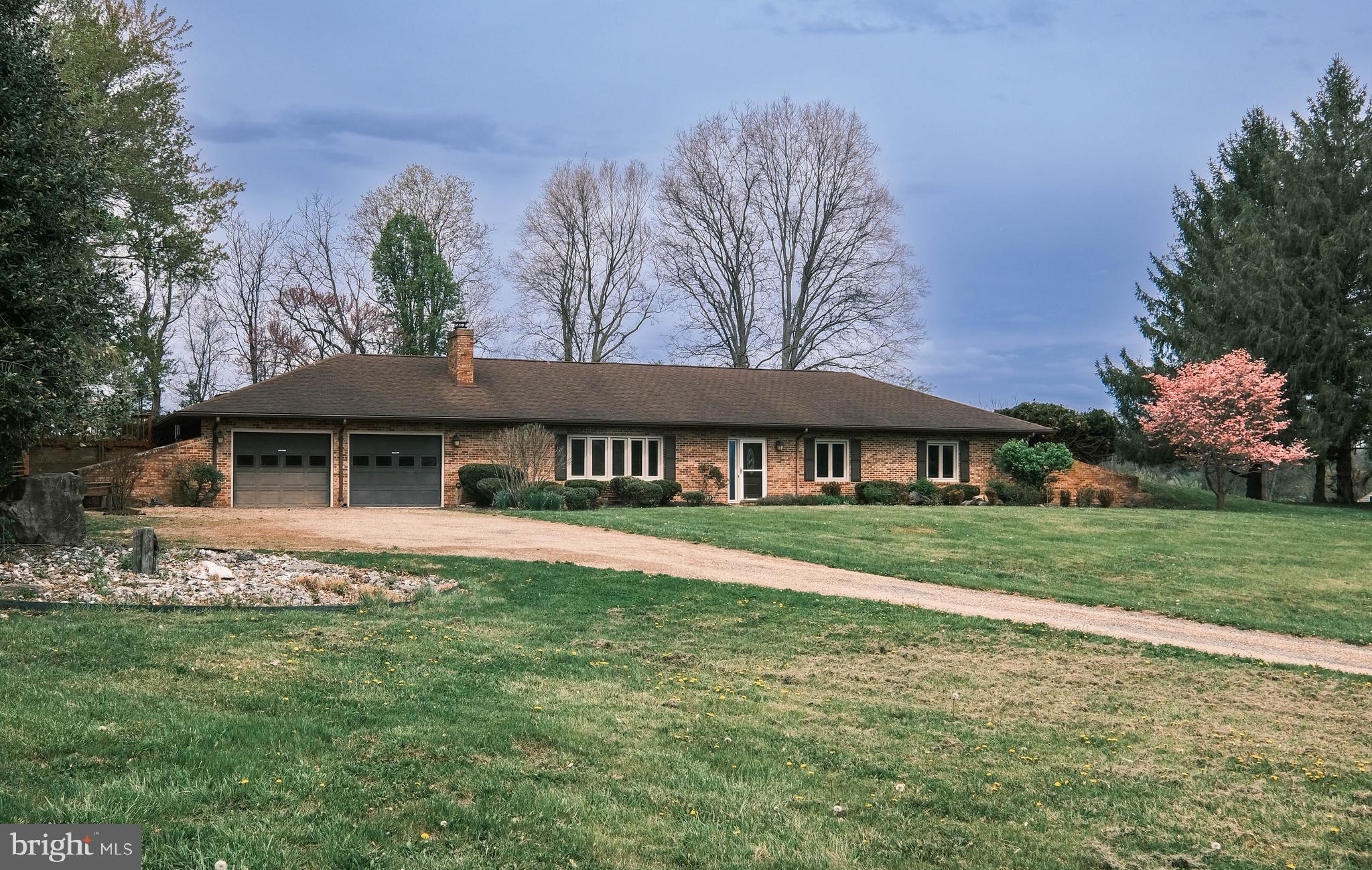225 Bowling Green Road Front Royal, VA 22630 - Photo 3 of 77 a front view of a house with garden