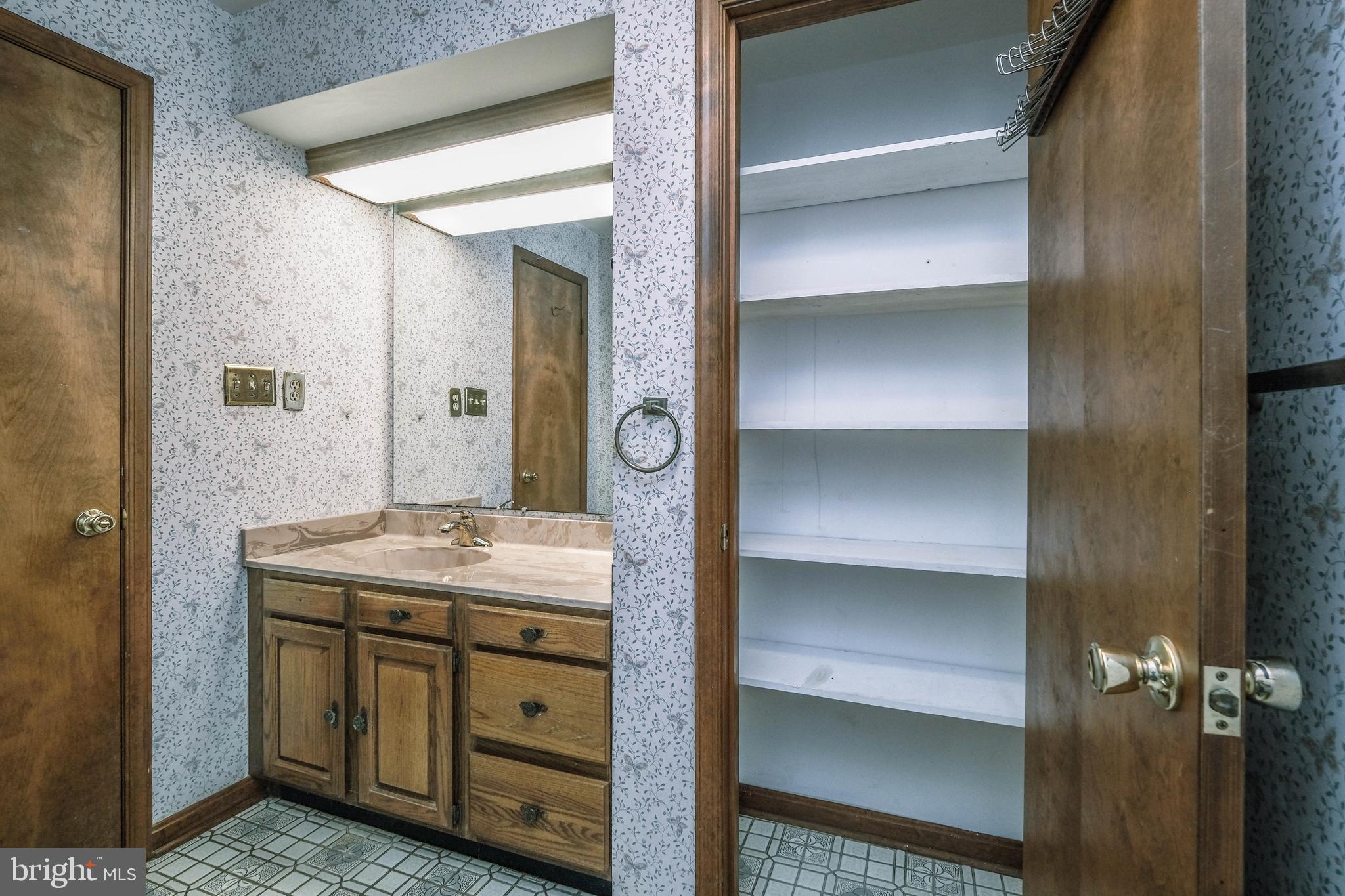 225 Bowling Green Road Front Royal, VA 22630 - Photo 35 of 77 a bathroom with a granite countertop sink and a mirror