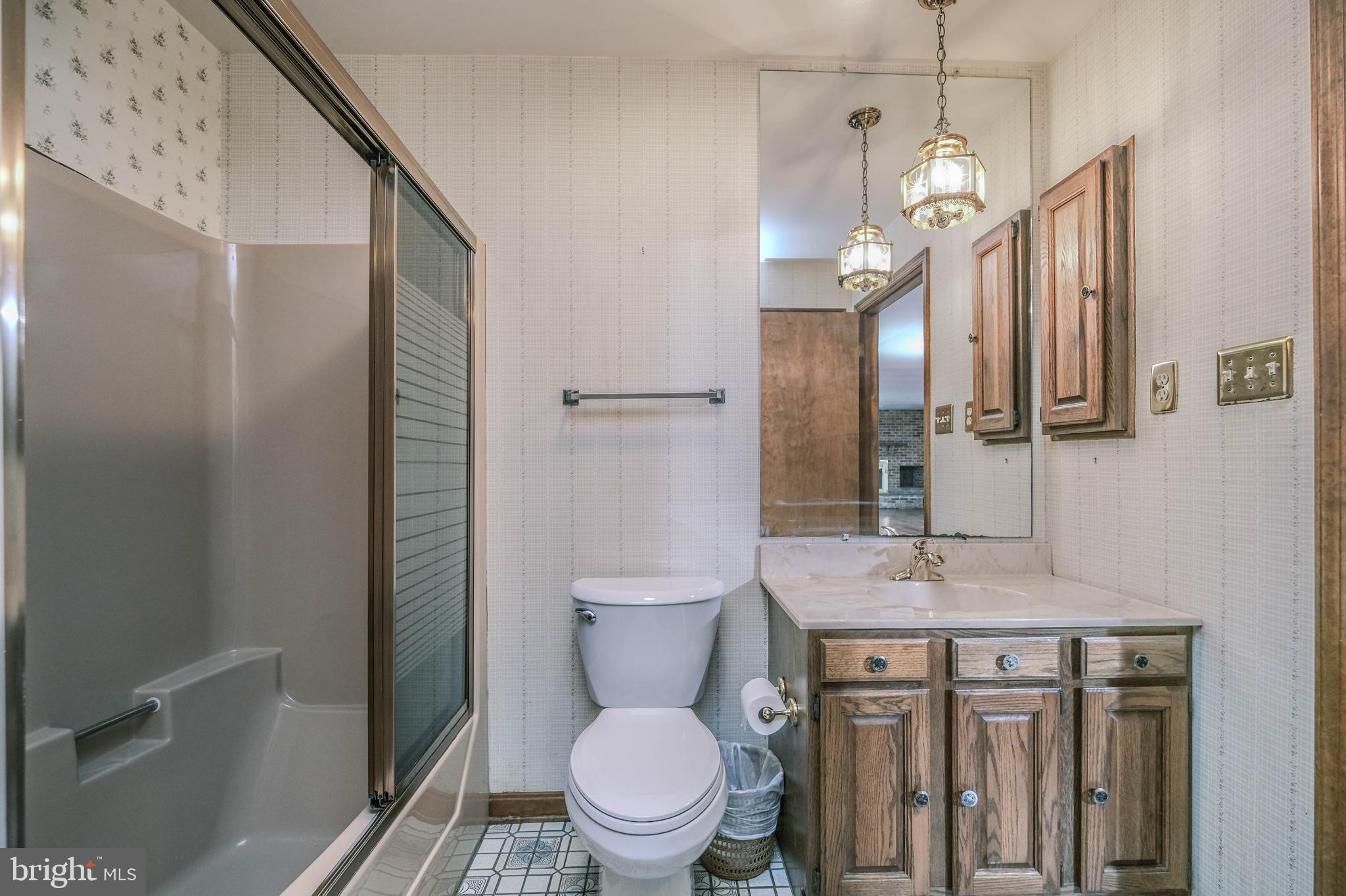 225 Bowling Green Road Front Royal, VA 22630 - Photo 39 of 77 a bathroom with a granite countertop toilet sink and mirror