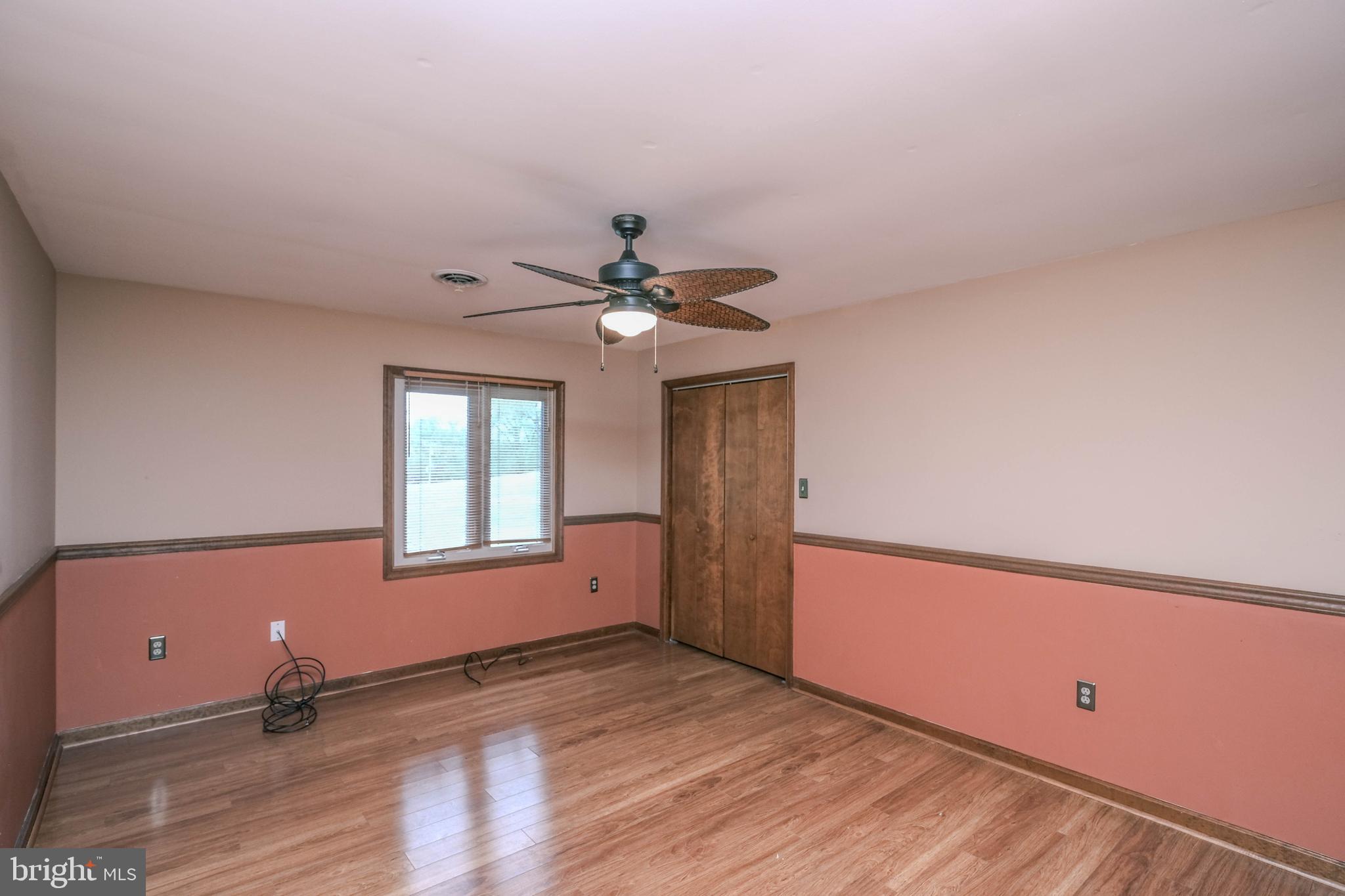 225 Bowling Green Road Front Royal, VA 22630 - Photo 41 of 77 an empty room with wooden floor and windows