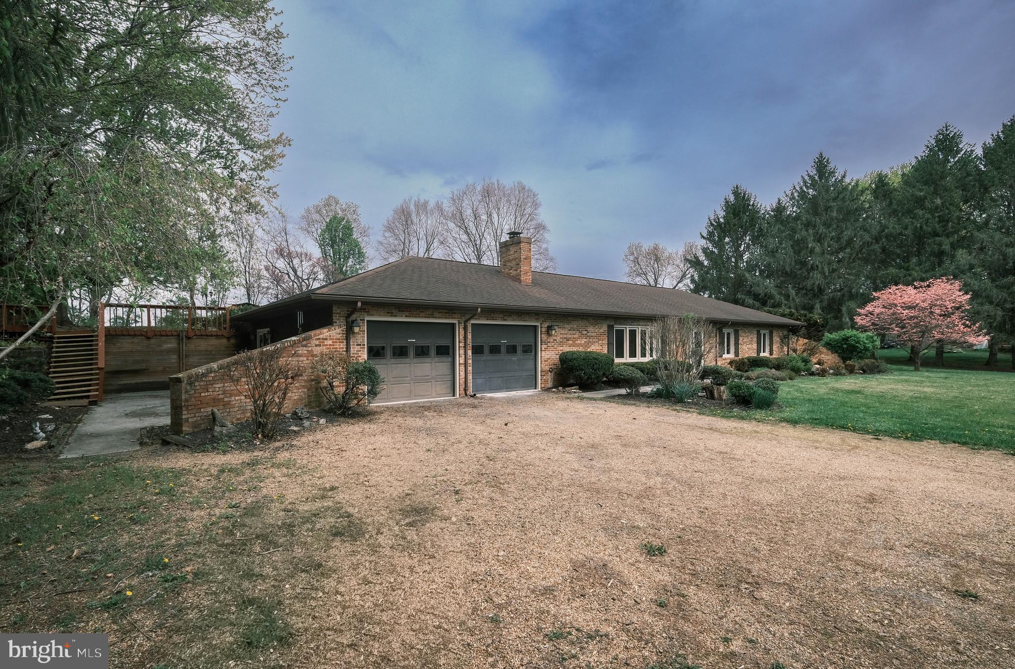 225 Bowling Green Road Front Royal, VA 22630 - Photo 53 of 77 a front view of a house with a garden