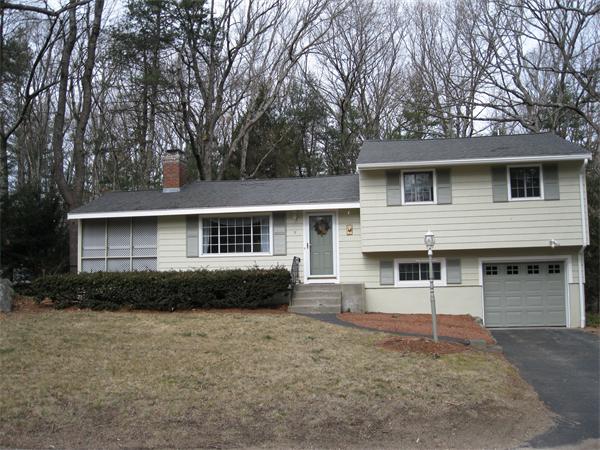 8 Tanbark Road Sudbury, MA 01776 - Photo 1 of 27 a front view of a house with a garden and yard