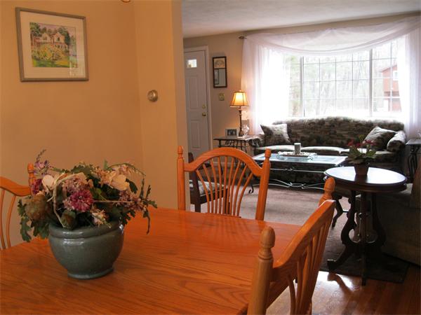 8 Tanbark Road Sudbury, MA 01776 - Photo 12 of 27 a view of a dining room with furniture and chandelier