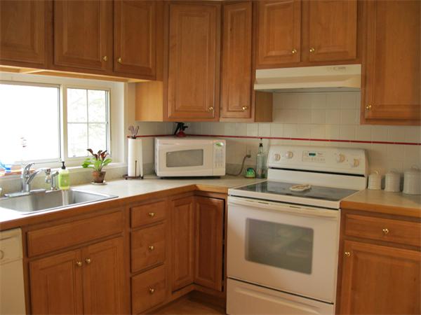 8 Tanbark Road Sudbury, MA 01776 - Photo 14 of 27 a kitchen with a sink and cabinets