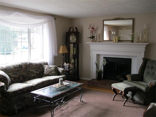 8 Tanbark Road Sudbury, MA 01776 - Photo 6 of 27 a living room with furniture and a fireplace