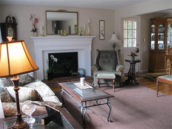 8 Tanbark Road Sudbury, MA 01776 - Photo 7 of 27 a living room with furniture and a fireplace