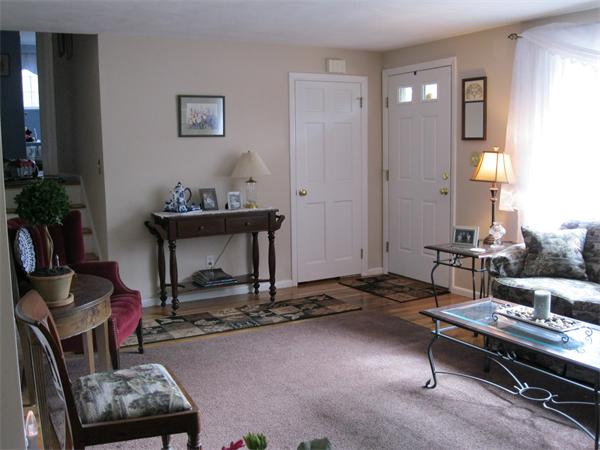 8 Tanbark Road Sudbury, MA 01776 - Photo 8 of 27 a living room with furniture a rug and a fireplace