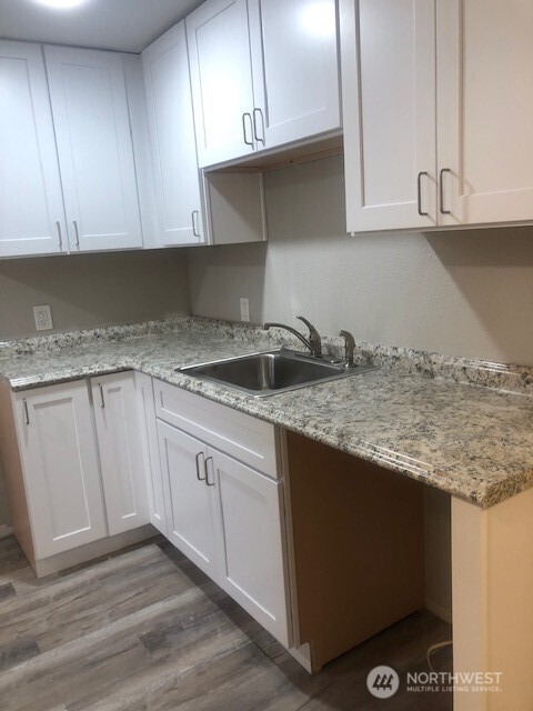 1355 State Avenue, Unit B Marysville, WA 98270 - Photo 6 of 10 a kitchen with granite countertop cabinets and sink