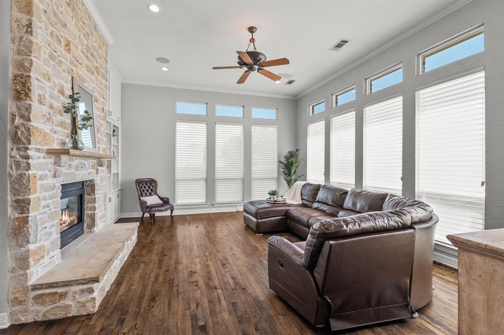 1101 Trail Ridge Drive McKinney, TX 75072 - Photo 14 of 37 a living room with furniture fireplace and floor to ceiling windows