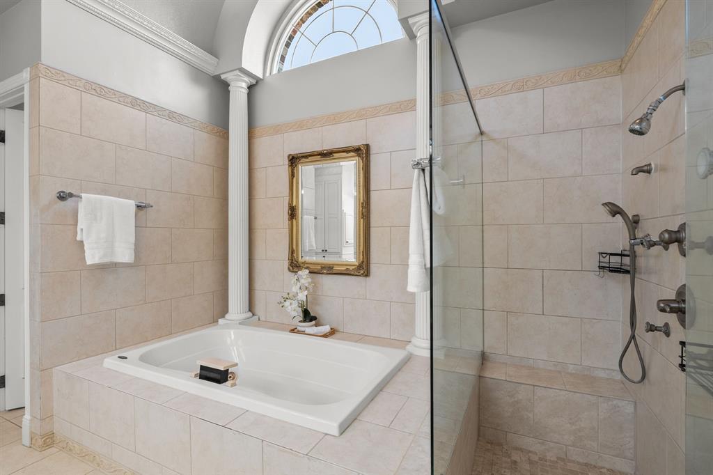 1101 Trail Ridge Drive McKinney, TX 75072 - Photo 19 of 37 a bathroom with a tub sink and mirror